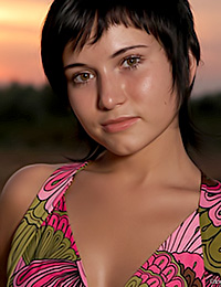 The darkness of the summer evening is hiding the beautiful naked hottie