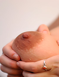 Here she fucks herself with a large dildo for your pleasure